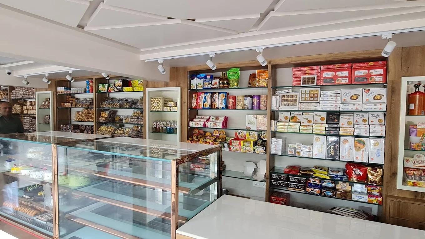 RT Bakers store interior with shelves full of baked goods and confectionery