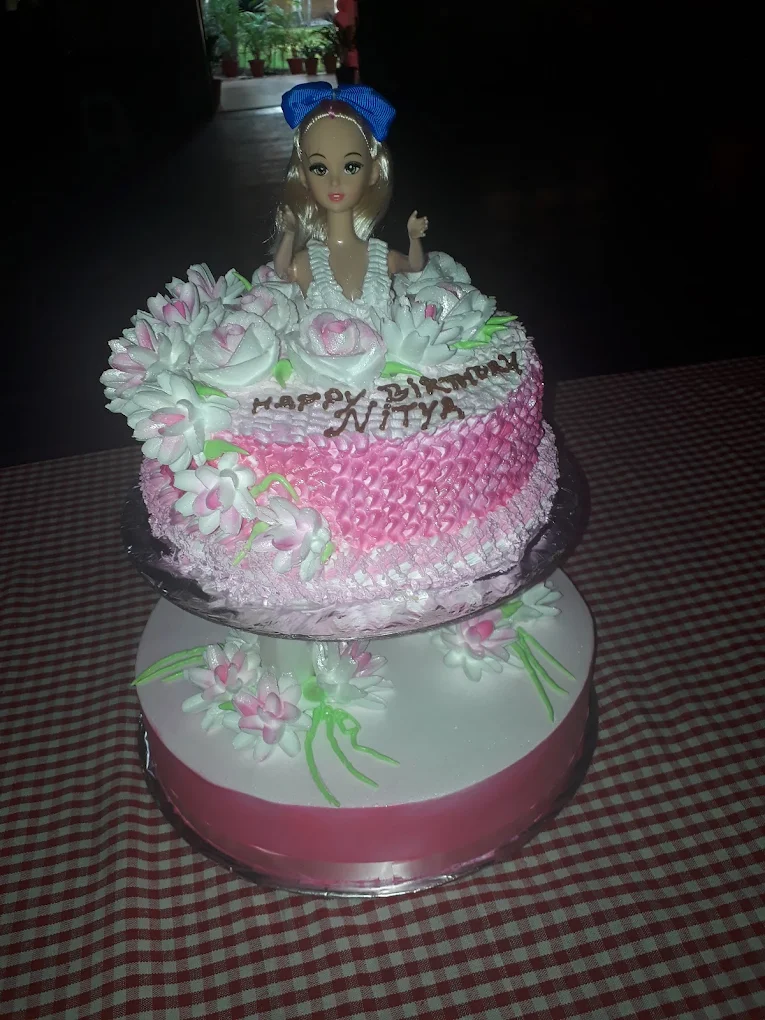 Barbie doll princess cake with pink floral frosting