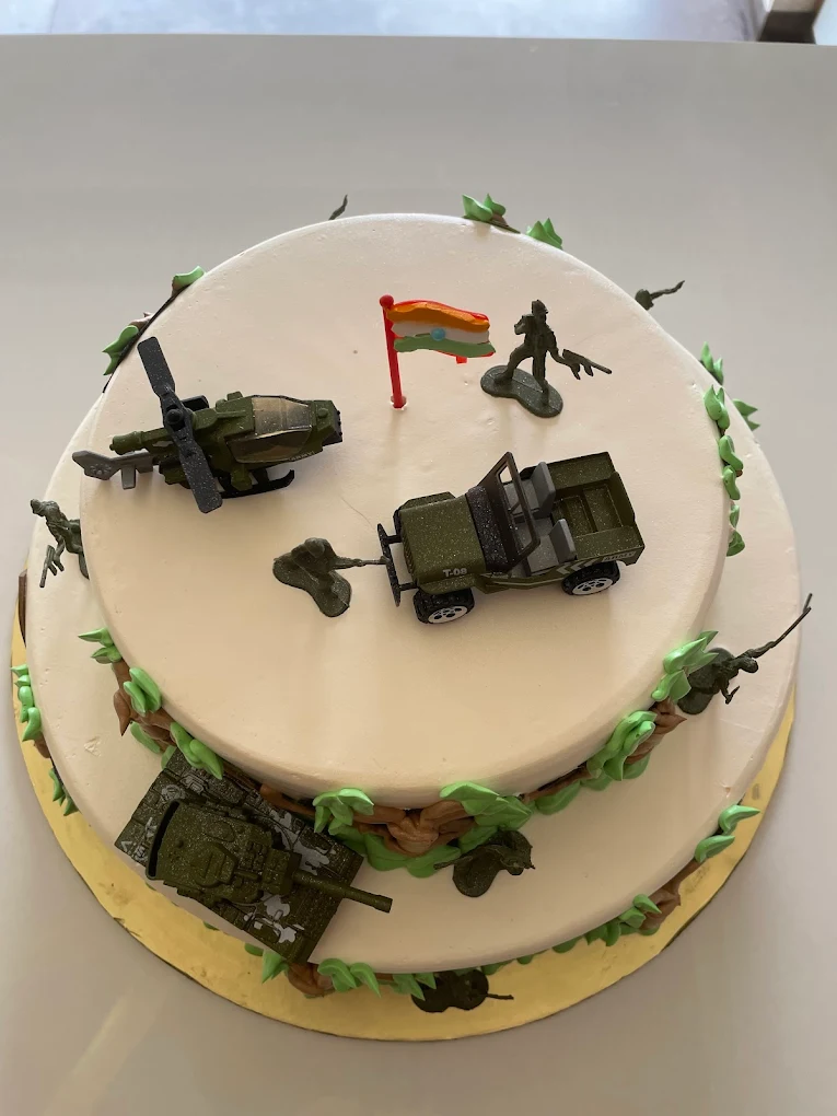 Indian Army themed cake top view with flag and vehicles