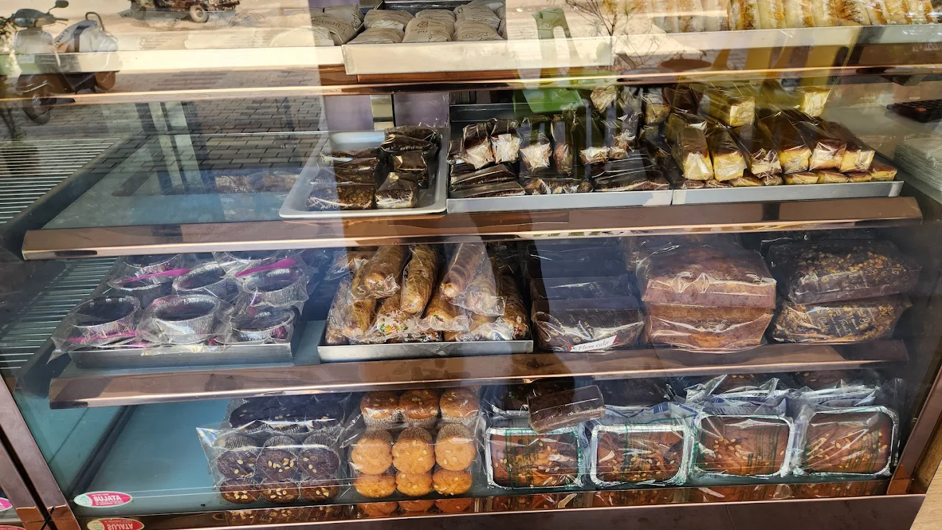 Fresh pastries and cakes in the glass display counter